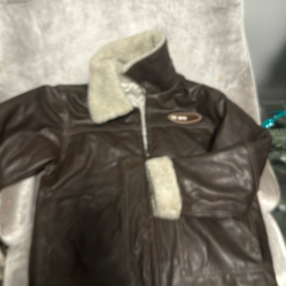 Kids jacket used has a little tear on it